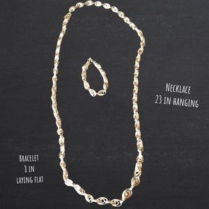 Silver tone long necklace with matching bracelet.